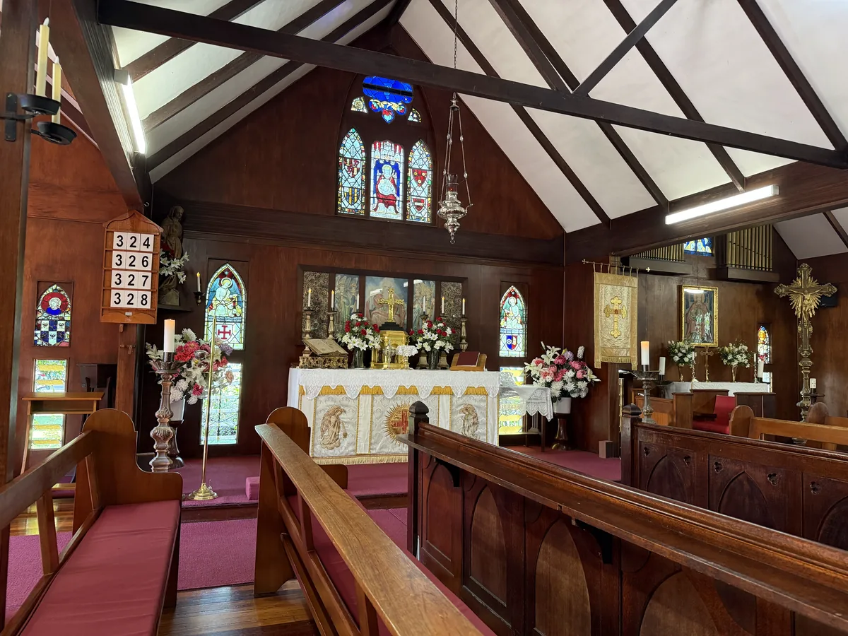 Altar and stained glass windows inside The Abbey Church.